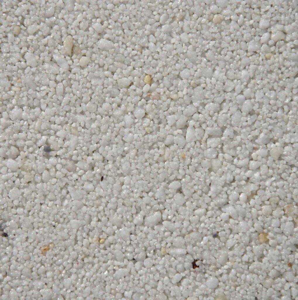 Arctic White resin bound aggregate colour for driveways, patios and pathways. Premium resin bound surfacing by Kola Construction, serving Dorset, Bournemouth, Poole and London.